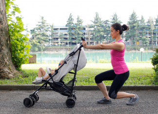 A woman exercising with a stroller.