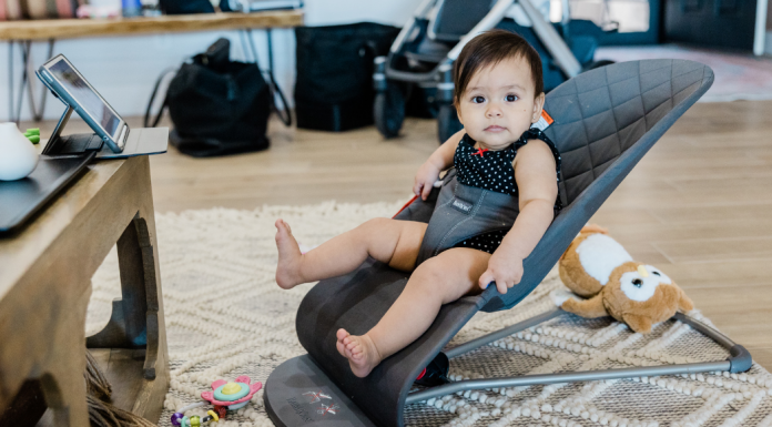 A baby in a bouncer.
