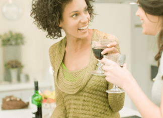 Two women drinking wine.