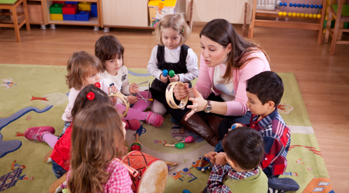 A preschool class sitting in a circle.