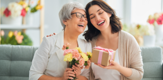 Two moms celebrating mother's day with gifts.