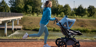 A woman running with a stroller.