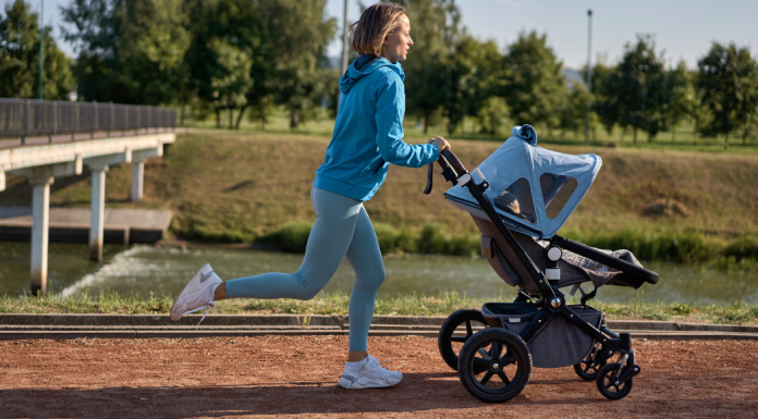 A woman running with a stroller.