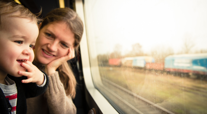 A boy on a train ride.