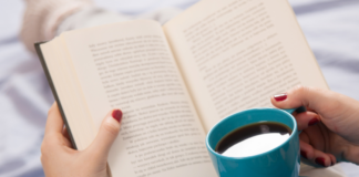 Reading with a cup of coffee.