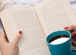 Reading with a cup of coffee.