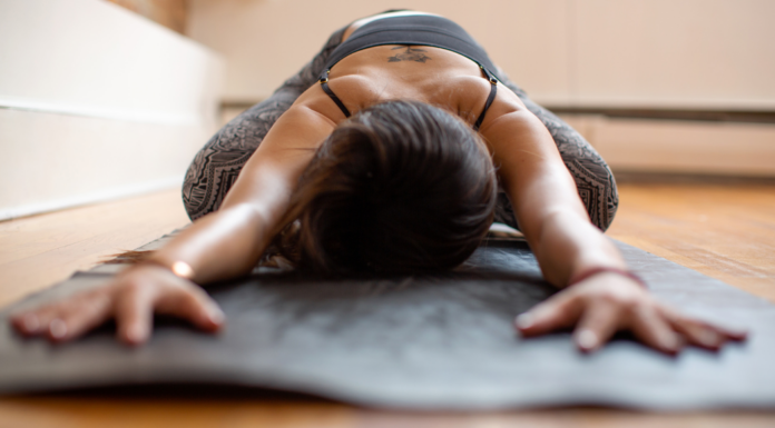 Meet Jacqueline: Yoga Mom Putting the “OM” in “MOM” A woman doing yoga.