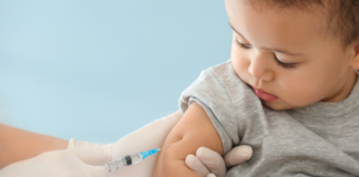 A toddler boy getting a vaccine.