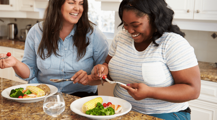 Two women eating a healthy meal.