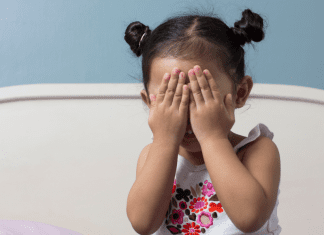 My Favorite Milestones So Far Toddler covering her eyes.