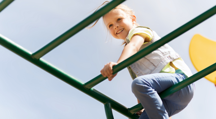 A girl climbing on the playground.