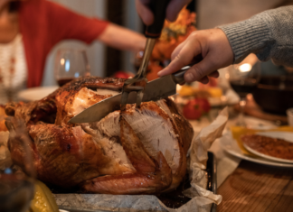 Thanksgiving Traditions Carving a turkey on Thanksgiving.