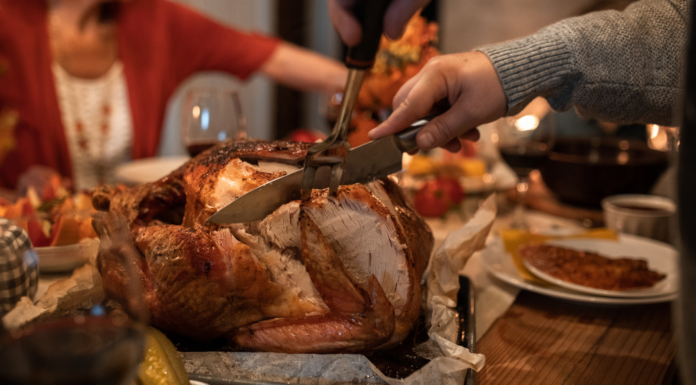 Carving a turkey on Thanksgiving.