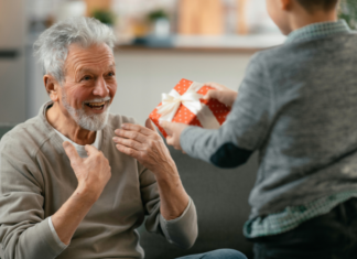 A boy giving a gift.