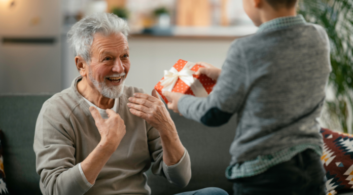 A boy giving a gift.
