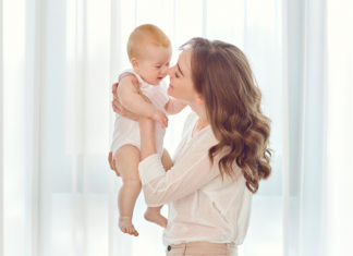 Meet Melissa: A Mama In Transition A mom kissing her baby.