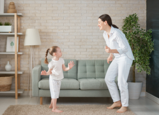 Play It Again, Mommy A mom and daughter dancing.