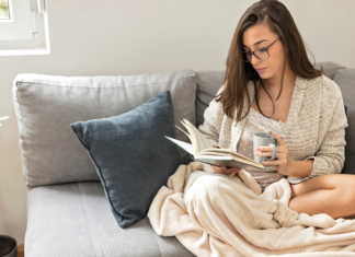 A woman reading a book from a local Fairfield County author.