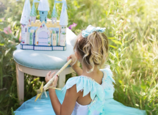 The Lessons to Be Learned From the Movie “Frozen” A girl dressed like a princess playing with the Frozen castle.