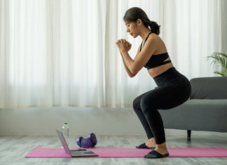 Top 10 Ways to Stick to a Fitness Resolution A woman sticking to her fitness goals.