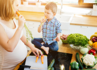 Meet Erica: The Mom Who Can’t Forget A pregnant mom feeding her son.