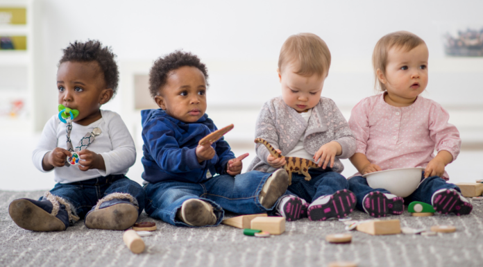Babies playing at a play date co-op.