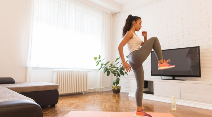 A woman doing a at-home morning workout.