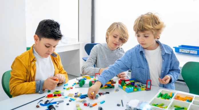 Boys playing with Legos.