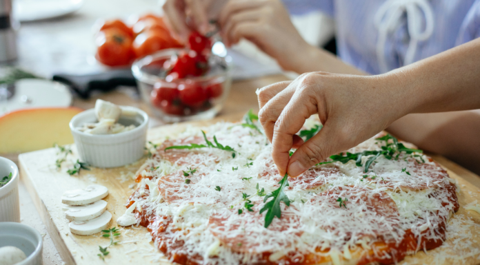 Making a pizza.