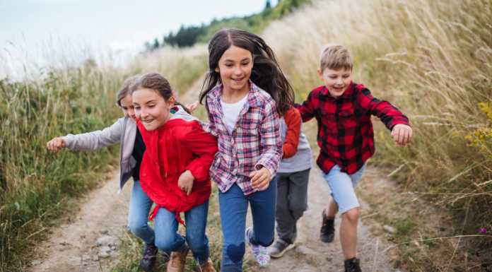 Kids running in a field.