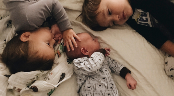 Siblings with a new baby.