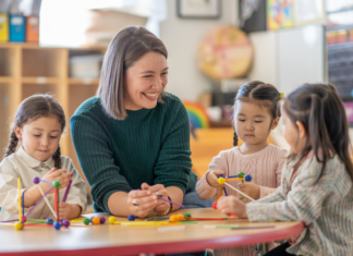 A kindergarten teacher with three students.