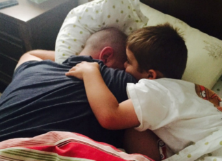 Cuddling with daddy.