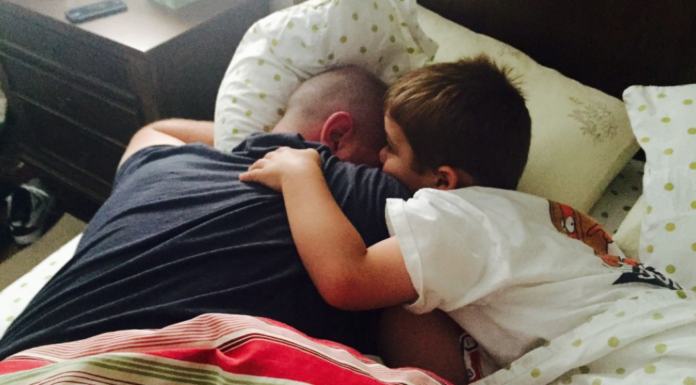 Cuddling with daddy.