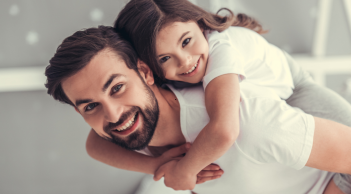 A dad with his daughter.