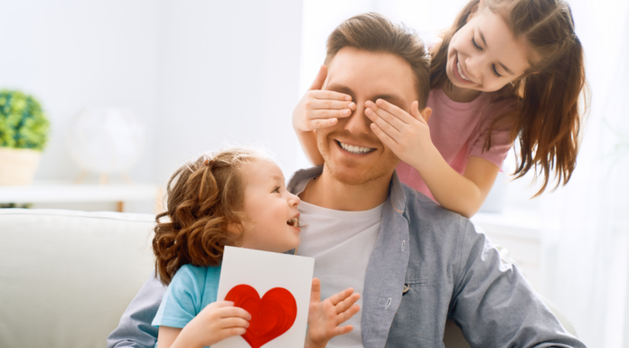 Giving a dad a Father's Day gift.
