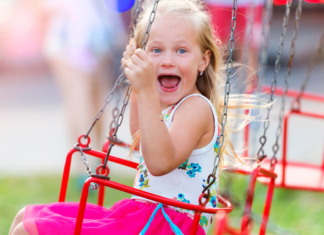 Summer Fairs and Festivals in Fairfield County A girl on swing at a summer fair.
