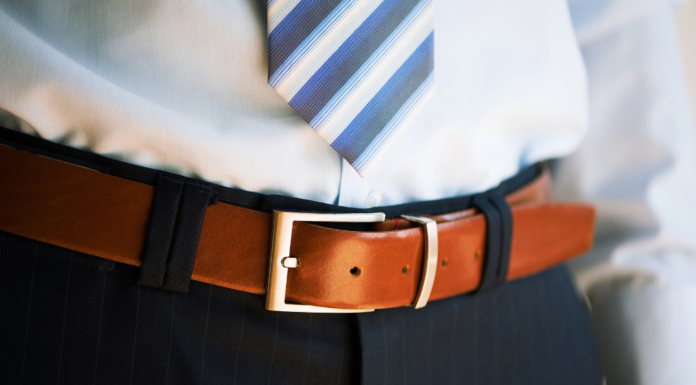A boy wearing a belt.