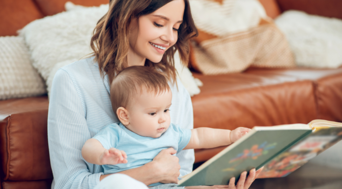 A mom showing a baby book to her baby.