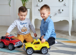 Boys playing with trucks.