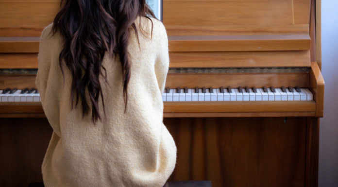 A woman playing the piano.