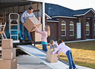 Movin’ On Up – Tips For Moving With Children A family unpacking a moving van.