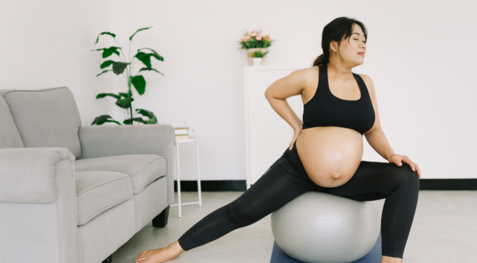 A pregnant woman doing yoga.