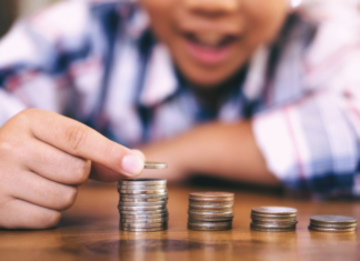 A boy counting his money.