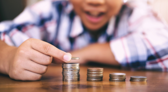 A boy counting his money.