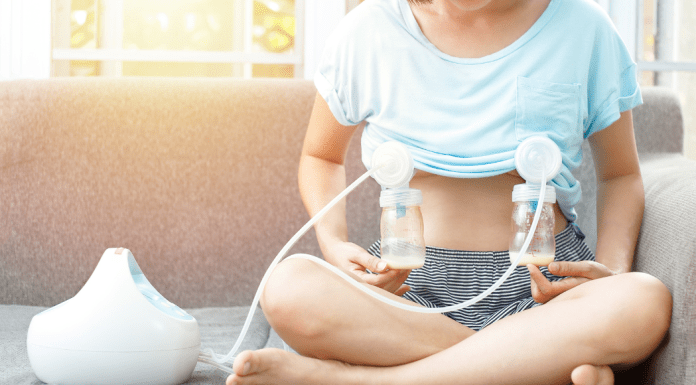 A woman hooked up to a breast pump.