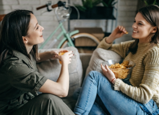 What I Want My Daughter To Know About Friendship Two friends sitting on a couch talking.