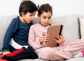 Kids watching YouTube on the tablet.