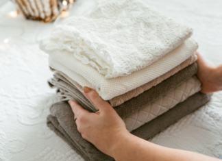 Climbing the Mountain: How to Get Control of All That Laundry! A woman folding laundry.