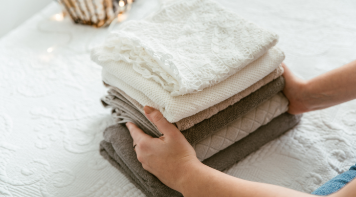 A woman folding laundry.